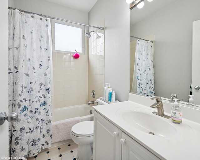 full bathroom with shower / bath combo, vanity, and toilet