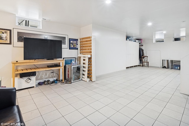 living area with light tile patterned floors and recessed lighting