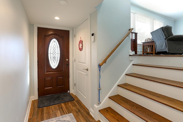 foyer entrance with recessed lighting, dark wood finished floors, baseboards, and stairs