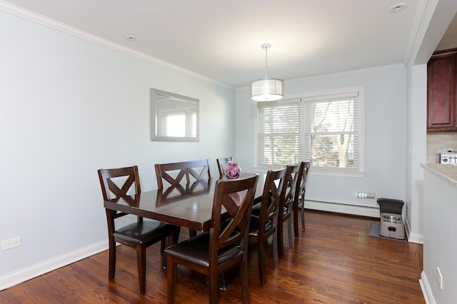 dining room featuring ornamental molding, dark wood-style flooring, baseboards, and baseboard heating