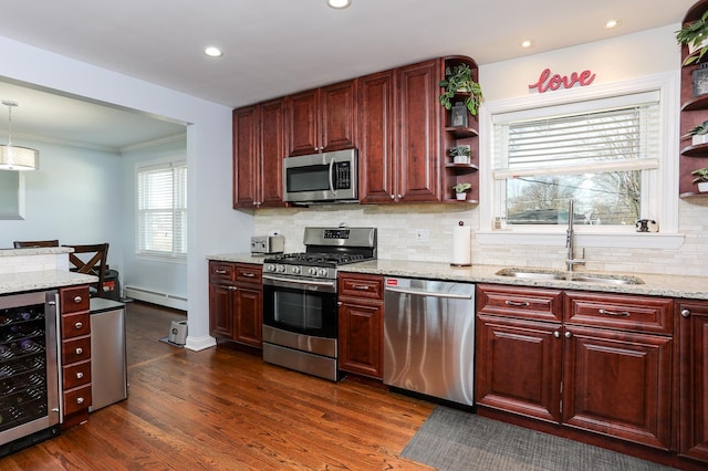 kitchen featuring wine cooler, appliances with stainless steel finishes, light stone countertops, open shelves, and a sink