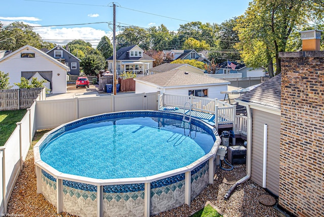 view of pool with a residential view, a fenced backyard, and a fenced in pool