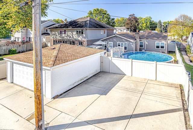 exterior space with a fenced in pool, a residential view, and a fenced backyard