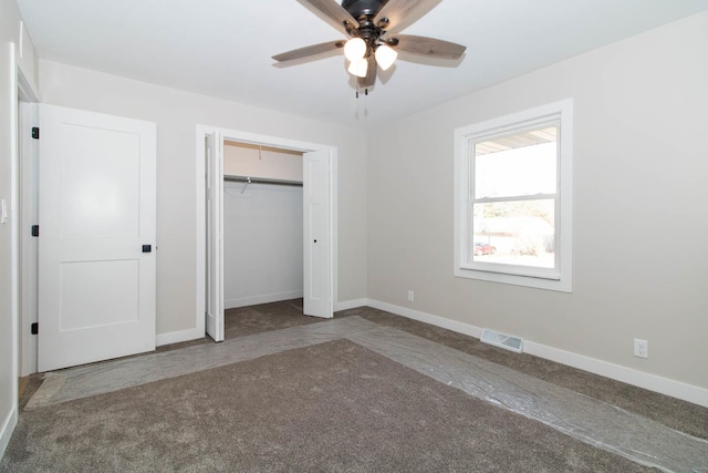 unfurnished bedroom with carpet, baseboards, visible vents, and a closet