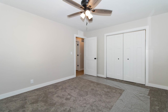 unfurnished bedroom featuring a closet, carpet flooring, a ceiling fan, and baseboards