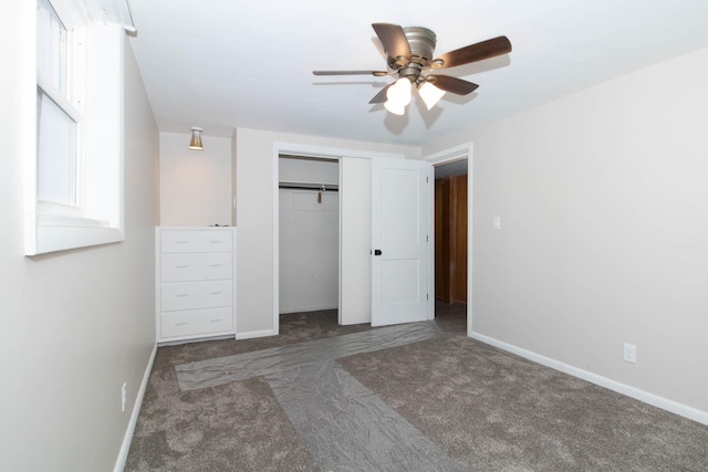 unfurnished bedroom with ceiling fan, a closet, carpet, and baseboards