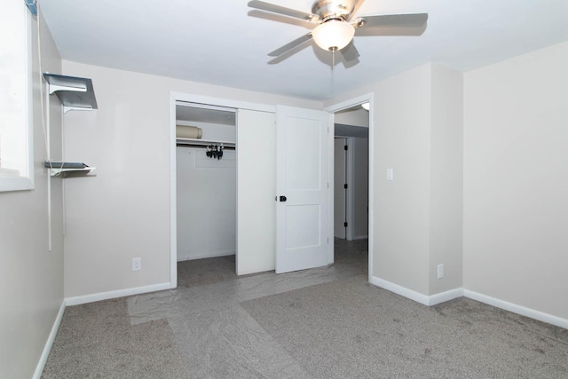 unfurnished bedroom with carpet floors, a ceiling fan, baseboards, and a closet