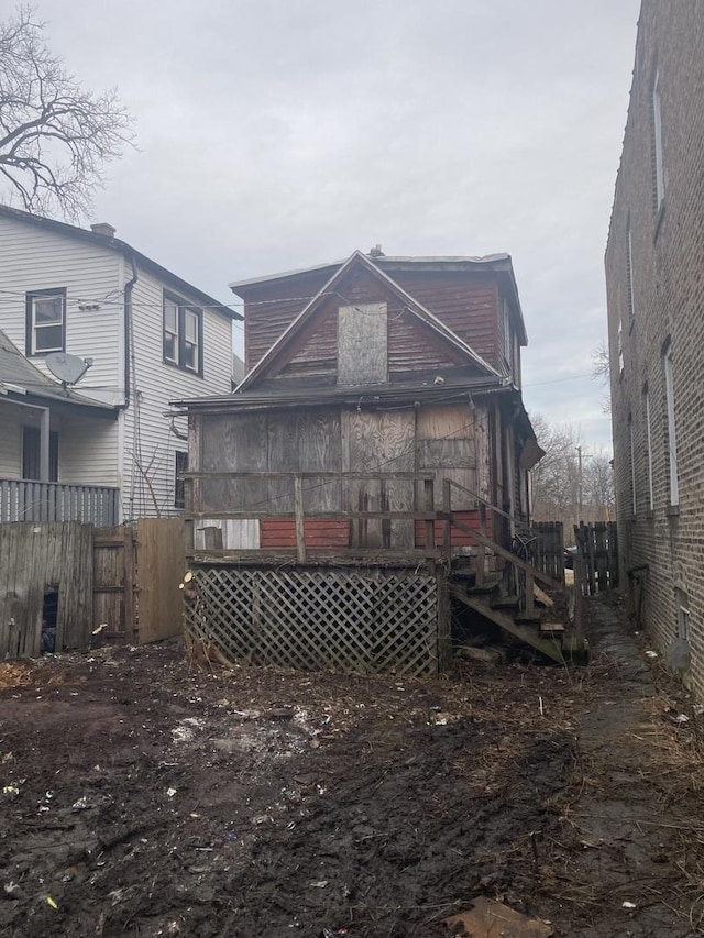 back of house featuring fence