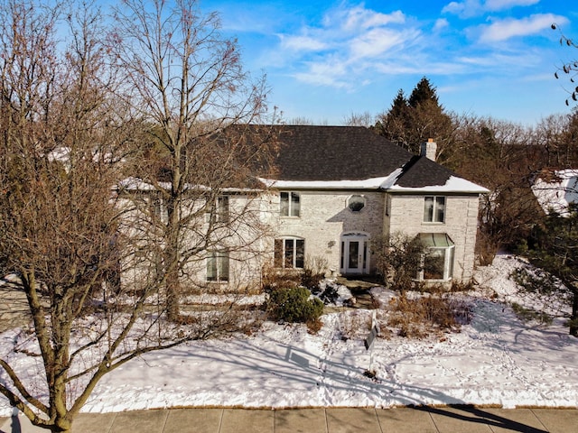 view of front of house featuring a chimney