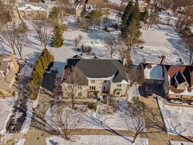 snowy aerial view featuring a residential view