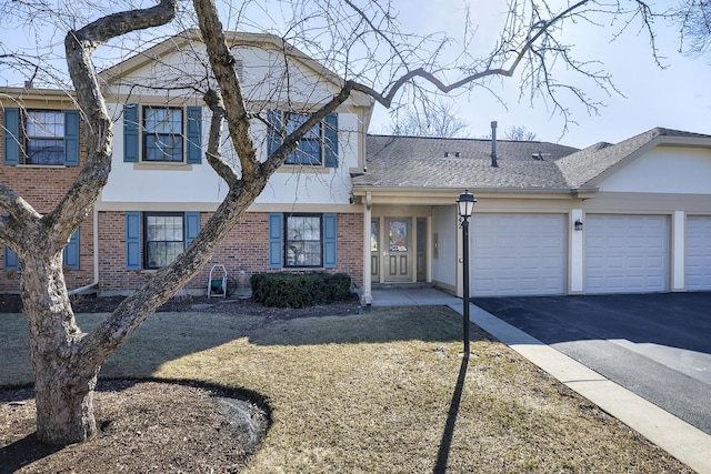 view of front of property with brick siding, roof with shingles, stucco siding, a garage, and driveway