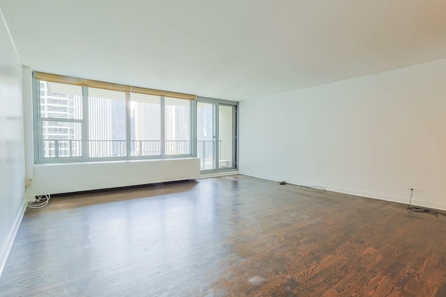 400 E Randolph St Unit 1824, Chicago, IL 60601 - empty room with baseboards, a healthy amount of sunlight, and wood finished floors