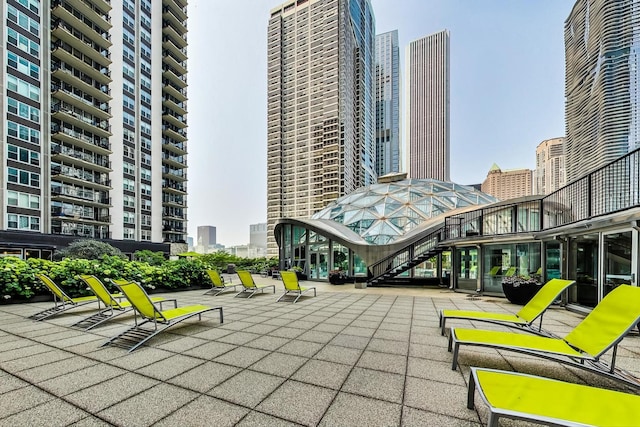 400 E Randolph St Unit 1824, Chicago, IL 60601 - exterior space featuring stairway, a city view, and a patio area