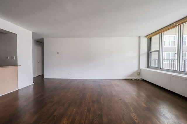 400 E Randolph St Unit 1824, Chicago, IL 60601 - unfurnished room featuring dark wood-style flooring and baseboards