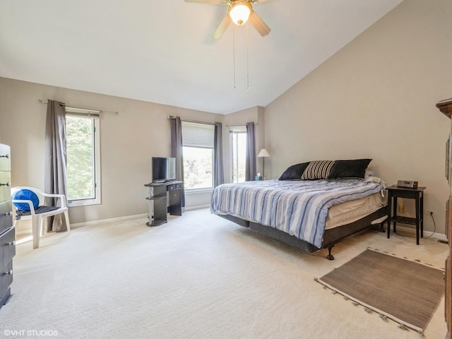 bedroom featuring lofted ceiling, carpet floors, multiple windows, and baseboards