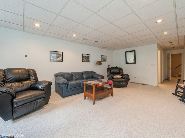 living room featuring carpet floors, electric panel, baseboards, and recessed lighting