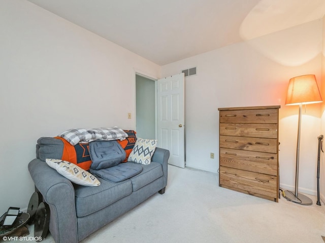 carpeted living room with visible vents