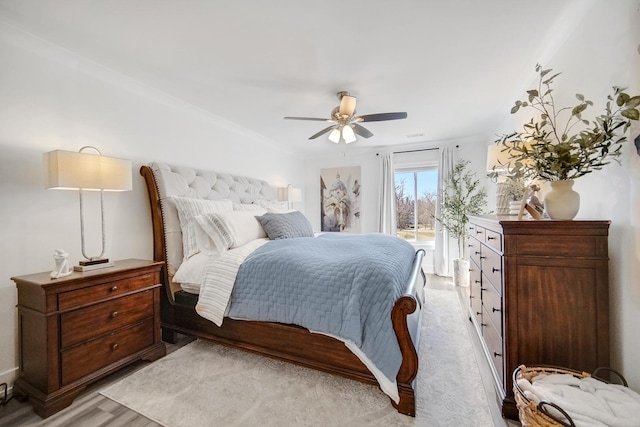 bedroom with a ceiling fan, access to outside, and light wood finished floors