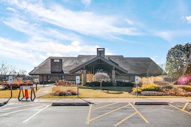 view of building exterior with uncovered parking