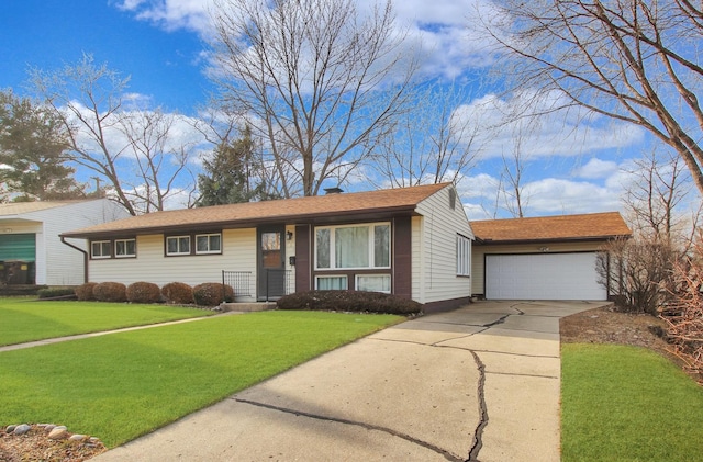 single story home with an attached garage, concrete driveway, and a front yard