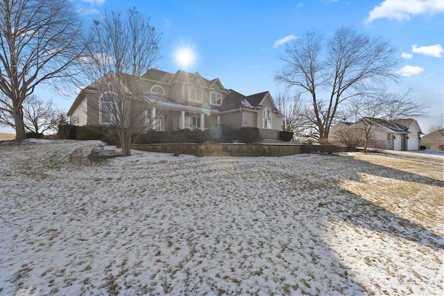 view of snowy exterior with a residential view