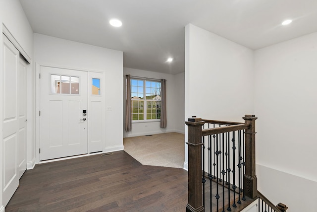 entryway featuring dark wood-style floors, recessed lighting, and baseboards