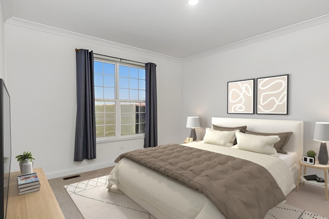 bedroom with ornamental molding, carpet, visible vents, and baseboards