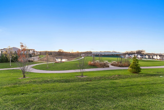 view of home's community with a residential view and a yard