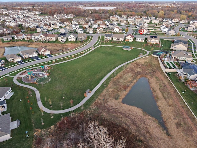 aerial view with a water view and a residential view