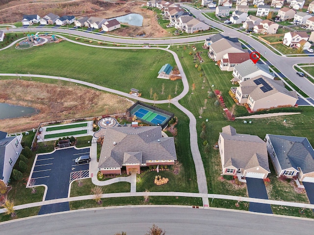 birds eye view of property with a residential view