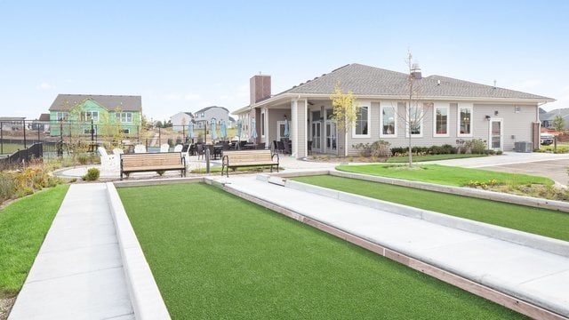 exterior space with a chimney and fence