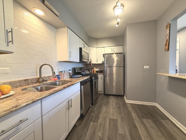7000 Mather Ave Unit 101, Chicago Ridge, IL 60415 - kitchen featuring appliances with stainless steel finishes, a sink, dark wood-type flooring, tasteful backsplash, and white cabinets