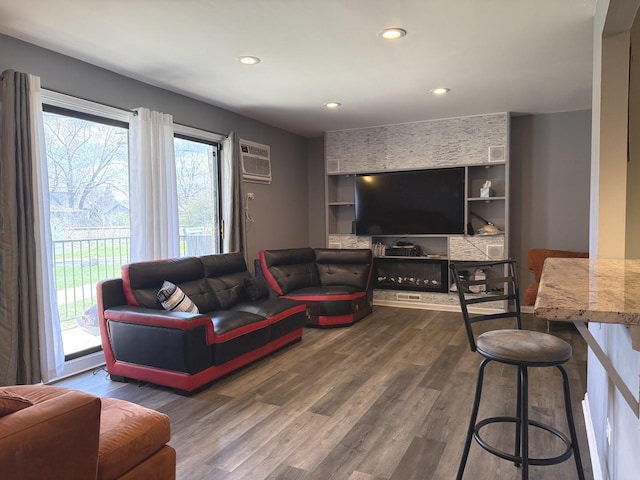 7000 Mather Ave Unit 101, Chicago Ridge, IL 60415 - living area featuring wood finished floors, an AC wall unit, recessed lighting, and built in shelves