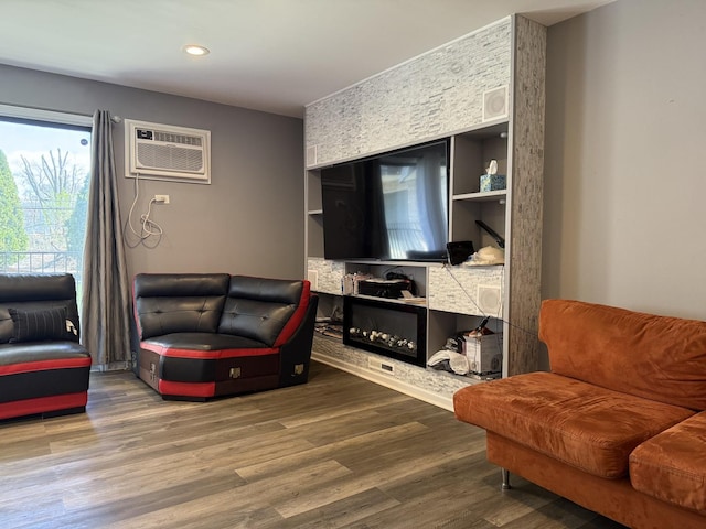 7000 Mather Ave Unit 101, Chicago Ridge, IL 60415 - living room featuring a wall mounted air conditioner, wood finished floors, built in features, and recessed lighting