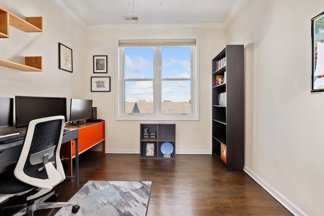 office featuring ornamental molding, visible vents, baseboards, and wood finished floors