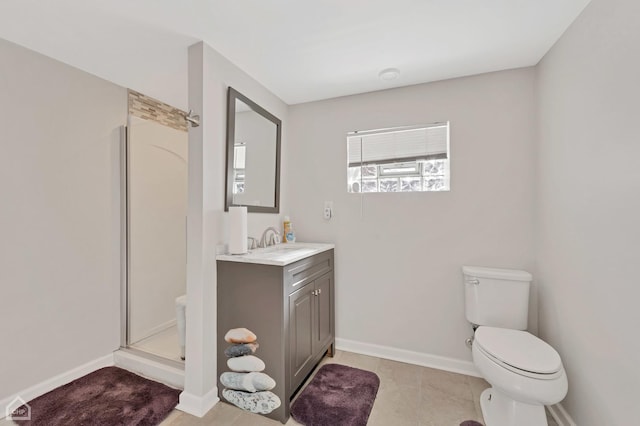 full bath with baseboards, toilet, a shower stall, and vanity