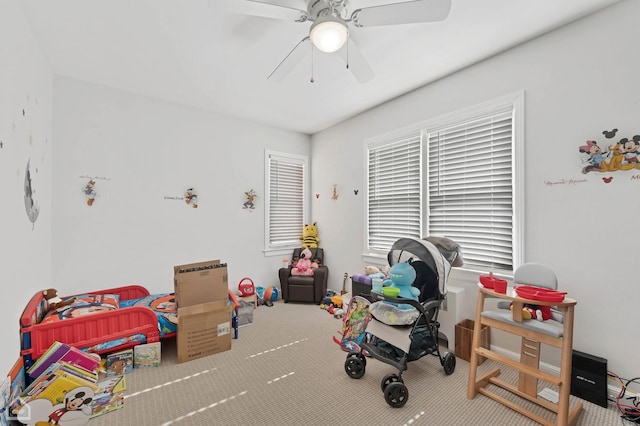 game room featuring carpet floors and a ceiling fan