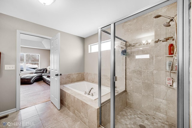 ensuite bathroom with a stall shower, ensuite bath, a bath, and tile patterned flooring