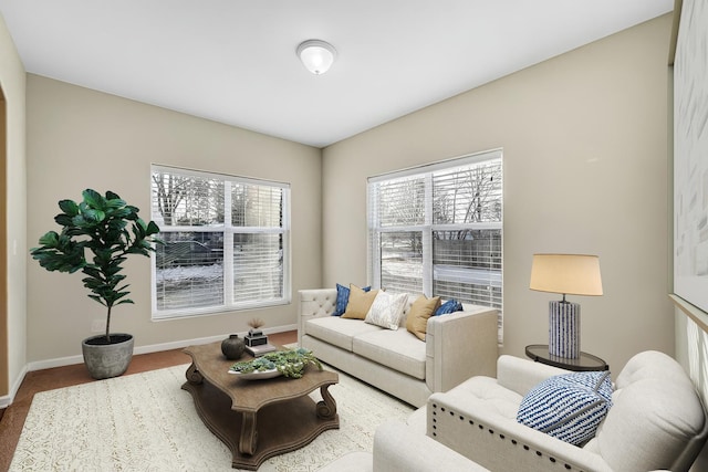 living room with baseboards and carpet floors