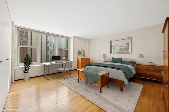 bedroom with wood finished floors