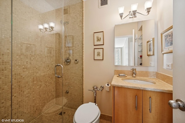 full bath featuring toilet, a shower stall, visible vents, and vanity