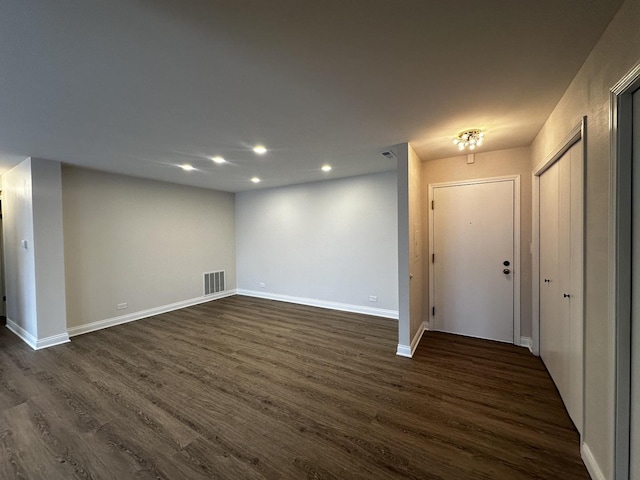 interior space with recessed lighting, visible vents, dark wood finished floors, and baseboards