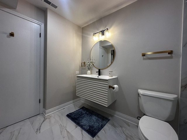 bathroom featuring marble finish floor, visible vents, toilet, and baseboards