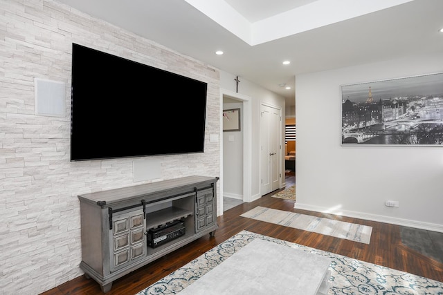 living room featuring baseboards, dark wood finished floors, and recessed lighting