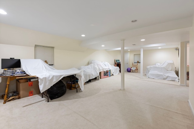 bedroom with light colored carpet and recessed lighting