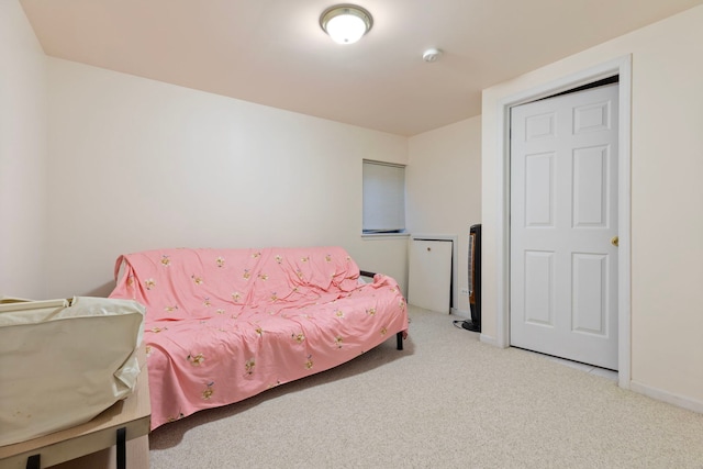 bedroom featuring carpet and baseboards