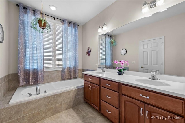 bathroom featuring tile patterned floors, a garden tub, a sink, and double vanity