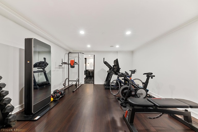 exercise area with crown molding, recessed lighting, wood finished floors, and baseboards