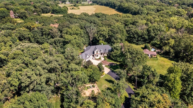 bird's eye view featuring a forest view