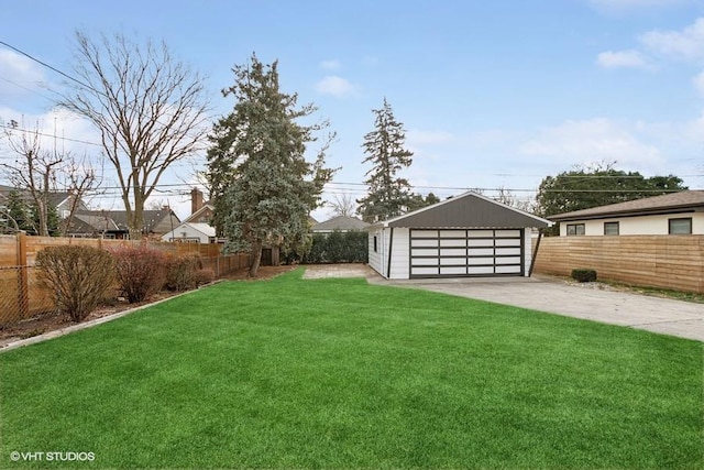 view of yard featuring a residential view, an outdoor structure, a detached garage, and fence